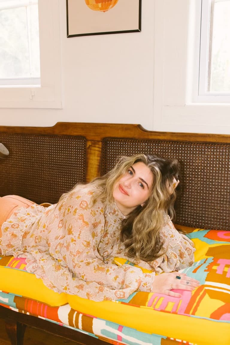 A relaxed portrait on the patterned studio daybed