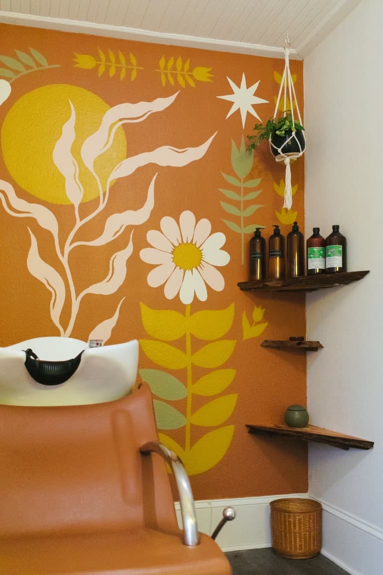 The floral mural and shampoo corner at Trim