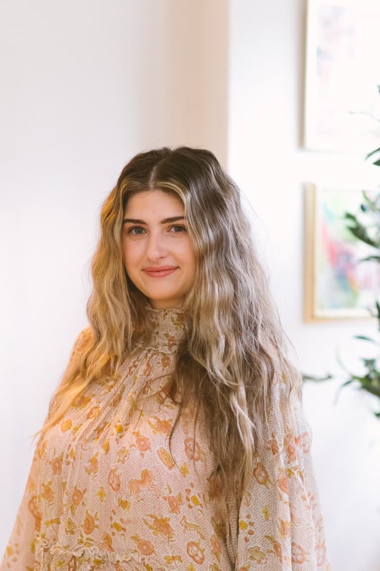 McKenzie in the sunlit Trim studio with soft blonde waves