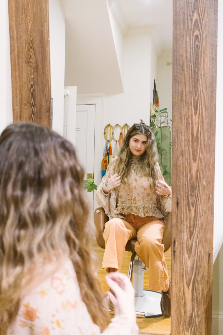 McKenzie reflected in the studio mirror at Trim